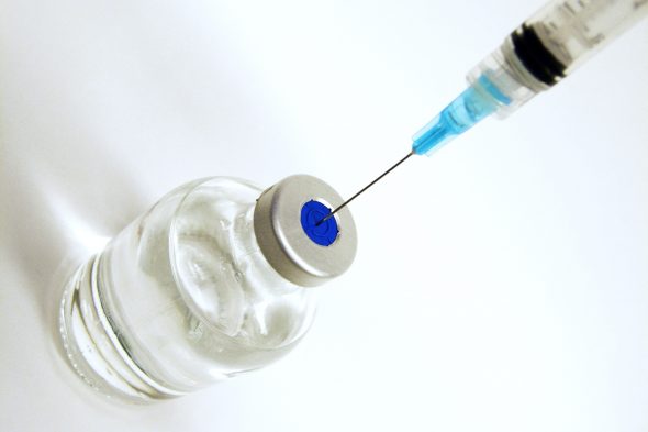 syringe and vial of clear liquid