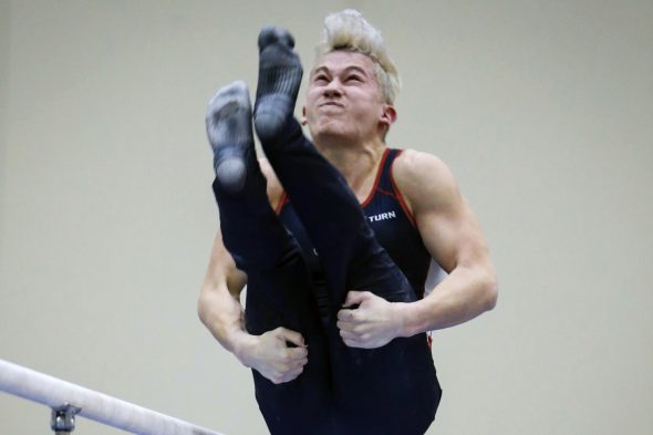 Male gymnast on the parallel bars