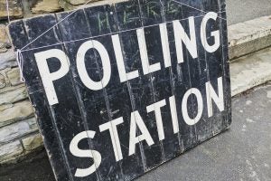 wooden sign reading "polling station"