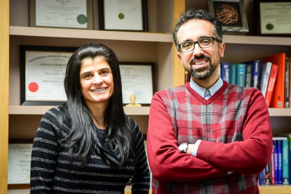 Professor Hossein Ataei and student Michelle Calcagno standing together in Hossein's office.