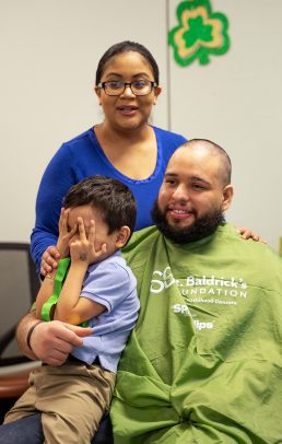Cancer survivor Isaac Felix with his parents, Raphael and Diana.