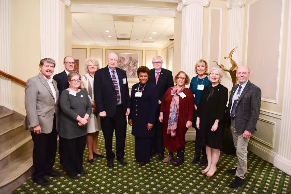 Dick Simpson, professor of political science and honoree, with steering committee members