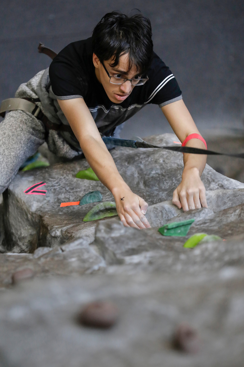 A student tries out rock climbing during the Campus Recreation open house at the Student Recreation Facility. Each semester, an open house is held for faculty, staff and students to see what Campus Recreation has to offer.
