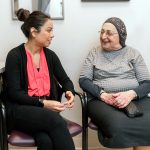 Former UIC occupational therapy student talks with a patient in the Self-management service of the Occupational Therapy Faculty Practice
