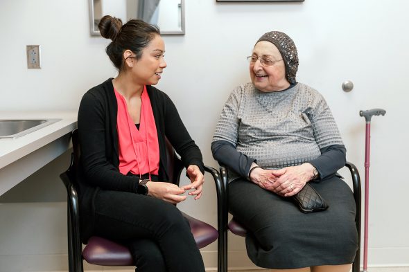 Former UIC occupational therapy student talks with a patient in the Self-management service of the Occupational Therapy Faculty Practice