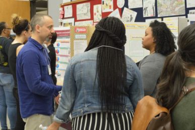 UIC College of Education Assistant Professor of Science Education Daniel Morales-Doyle speaks with public school teachers and alumna at a UIC gathering focusing on urban science education initiatives.