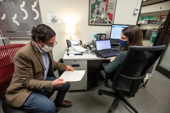 University archivist Leanna Barcelona and lecturer David Greenstein work in the archives at the University Library. (Joshua Clark/University of Illinois Chicago)