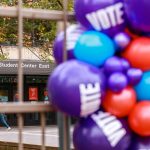 Purple, blue and red balloons with the word Vote