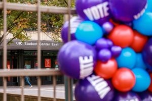 Purple, blue and red balloons with the word Vote