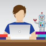 A man works on a laptop between two piles of books, one with a robot on top and one with a coffee cup on top.