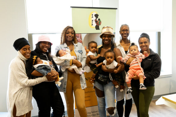 Members of BA NIA Inc. and mothers with their children. Left to Right: Aquilla Graves, Bryanna Woods, Tashiyana Jones, Faatimat Rufai, Mekazin Alexander and Dominique Graham. (Photo: Jenny Fontaine/University of Illinois Chicago)