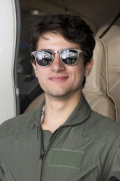 Images of Fall 2022 Interns in flight suits photographed in the Hangar. This is Daniel Caicedo StudentSpotlight 2023