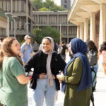 Students chatting in between classes during their first week of the fall semester, 2023. Photography by Jenny Fontaine