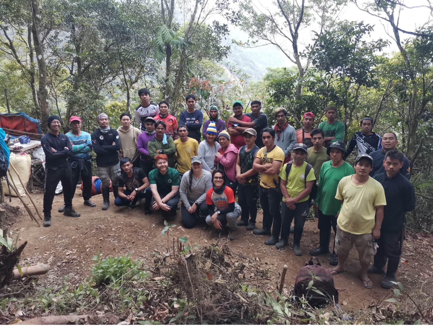The team of UIC Center for the Recovery and Identification of the Missing investigators, colleagues from the National Museum of the Philippines, mountaineers and Kalanguya community members pose at a site on Mt. Timay-Ak. (Photo: Gregg Abbang/National Museum of the Philippines)