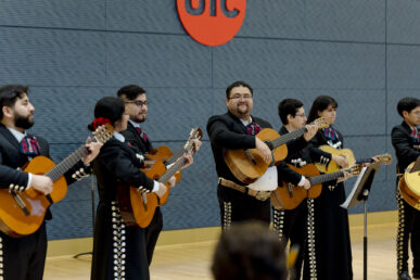 Several members of Mariachi Fuego line up to perform in front of an audience