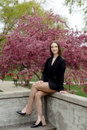 Student sits with their legs crossed