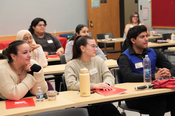 Students listen during a panel discussion.
