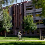 Person riding a bike on west campus. Photo by Martin Hernandez/UIC