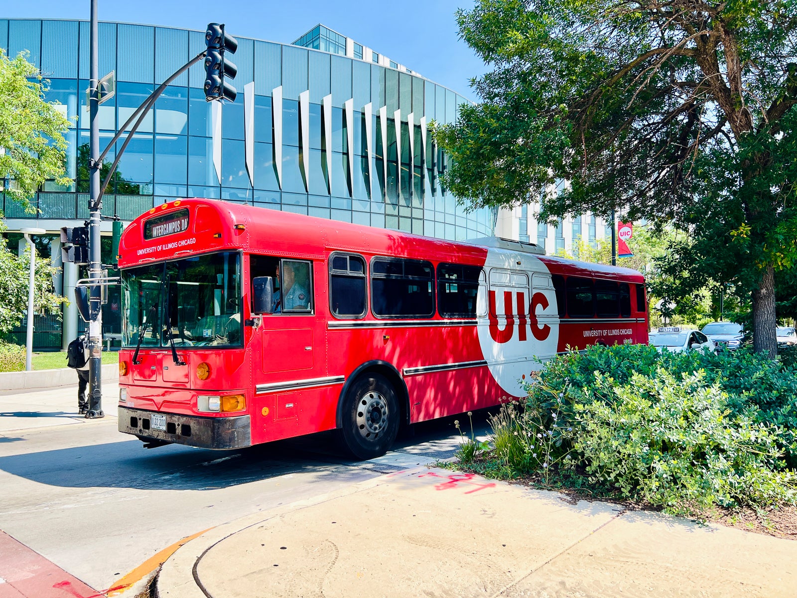 A red UIC shuttle bus