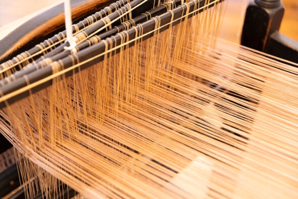 Closeup of string on a historic loom.