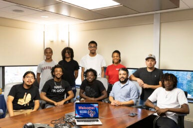 Students and coordinator involved in the Brothers Teaching program in the College of Education.