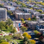 An aerial shot of Chicago's Humboldt Park neighborhood with a large sculpture of the Puerto Rican flag in the center.