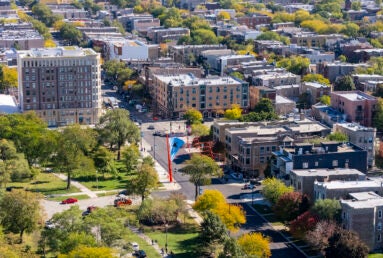 An aerial shot of Chicago's Humboldt Park neighborhood with a large sculpture of the Puerto Rican flag in the center.