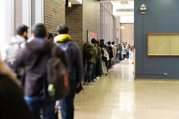 Photo of a long line of students outside the Pop-Up Pantry.