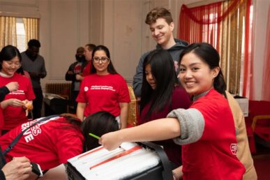 UIC students wearing red T-shirts participate in painting activities during the MLK Day of Service on Jan. 20, 2020.