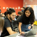 Mitravinda Manjunath assists student Guillermo Ramirez in the new Sandbox Lab